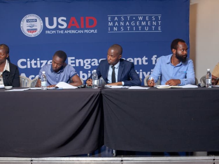 Adjudicators reviewing entries at the USAID and East West Management Institute youth pitch competition.