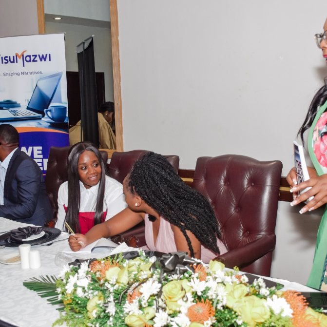 A speaker addressing guests at a TisuMazwi book launch.