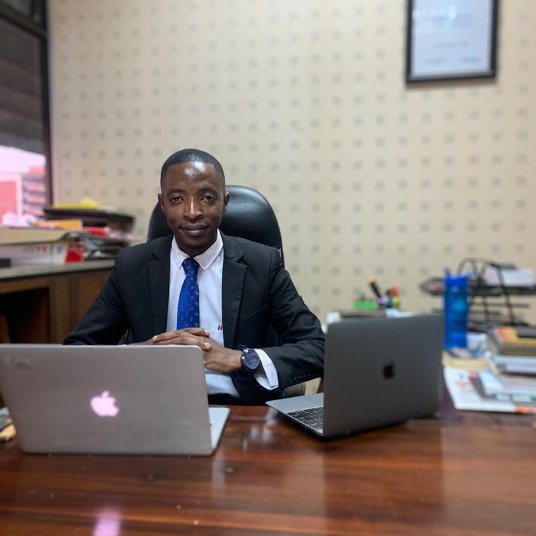 A TisuMazwi team member working at the studio desk.